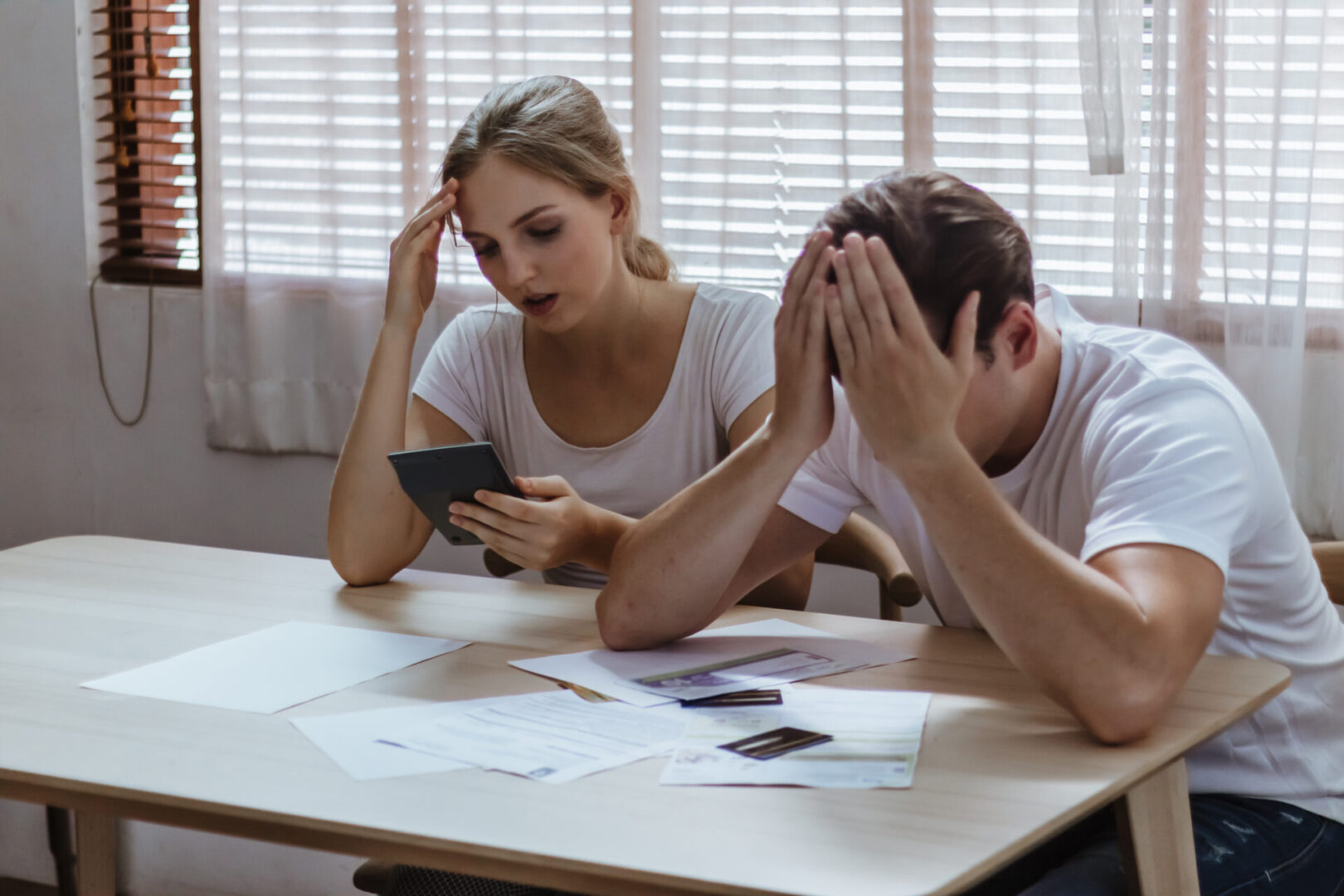 Stressed couple due to high interest debts